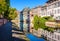 Half-timbered houses reflecting in the canal in the Petite France historic quarter in Strasbourg, France