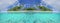 HALF UNDERWATER: Panoramic view of a tropical sandy beach and turquoise ocean.