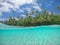 HALF UNDERWATER: Stunning shot of serene paradise island shoreline on sunny day.