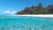 HALF UNDERWATER: Turquoise ocean water washes the breathtaking white sand beach.