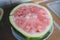 half of unripe watermelon with white seeds