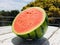 Half watermelon on white wooden table in outdoor