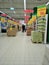 Hall large supermarket with notifications of discounts and sales, shelving products