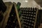 hall of white sparkling wine bottles in the winery cellar
