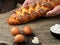 Ð¡hallah is laid out on the table, male hands. Ingredients for cooking braided bread. Closeup, shallow depth of field