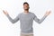 Hallelujah, man thanking god for great opportunity. Satisfied and relieved handsome modern male in grey sweater, raise