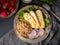 Halloumi, grilled cheese with quinoa, salad, radish. Balanced diet on dark background, top view