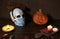 Halloween 2020 and coronavirus. Happy halloween Carving. Halloween pumpkin head lantern on wooden background, with burning candles