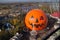 Halloween at the amusement park - a giant dome in the form of pumpkins on rides in the park. view of the park from above.