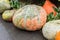 Halloween autumn decoration of pumkins, flowers and hay on street. Rural market concept