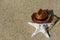 Halloween background on the beach with starfish and broom