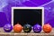 Halloween background concept. Blackboard with decor pumpkins, co