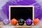 Halloween background concept. Blackboard with decor pumpkins, co