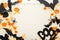 Halloween background with jack-o`-lanter,pumpkins, paper bats, spiders, confetti on white wooden background. Halloween holiday