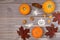 Halloween background of little pumpkins, walnuts,red maple leaves, and stenciled Halloween symbols