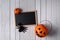 Halloween background with Pumpkins, black spider and chalkboard