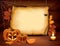 Halloween background with pumpkins, paper, candle