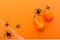 Halloween background with pumpkins, spider web and spiders as symbols of Halloween on the orange background. Happy Halloween