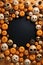 Halloween background with pumpkins and spiders. Top view. Copy space