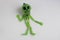 Halloween Background.A small green skeleton on a white background. Space for your text