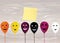 Halloween. Balloons with faces for a holiday. Multicolored inflatable balls. Complimentary ticket. Yellow sheet of paper for note