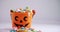 Halloween bucket filled up with various confectioneries 4k