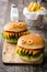 Halloween burger monsters on wooden table