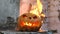 Halloween. Burning pumpkin. Medium shot