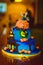 Halloween cake. Festive sweetness. Blue cake with figures of pumpkins and witches