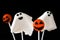 Halloween cake pops with phantom and pumpkin shape isolated on black background