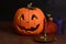 Halloween candle with pumpkin and bottles