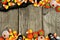 Halloween candy and black cloth double border against rustic wood