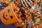 Halloween candy spilling out of orange pumpkin bucket