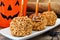 Halloween caramel apHalloween caramel apples with Jack o Lantern candy pail