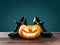 Halloween carved pumpkin near black witch shoes.