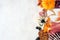 Halloween charcuterie side border against a white marble background