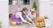 Halloween, children and pumpkins for sorting out candy sweets or treats together at home outside. Girl and boy siblings