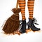 Halloween closeup witch legs in boots and with broomstick