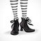 Halloween closeup witch legs in striped stockings and black boots