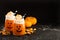 Halloween cold cocktail or drink with jack o`lantern face