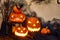 Halloween composition of burning pumpkin with bat. Cobwebs branches atmosphere