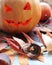 Halloween composition of jack o` lantern, pumpkins, illumination, mystical decor