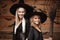 Halloween Concept - Closeup beautiful caucasian mother and her daughter in witch costumes celebrating Halloween posing