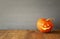 Halloween concept. Cute pumpkin on wooden table