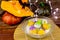 Halloween concept. Pumpkin and ghost white and yellow rice dumpling in coconut milk Bua Loy in transparency bowl on wooden