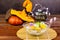 Halloween concept. Pumpkin and ghost white and yellow rice dumpling in coconut milk Bua Loy in transparency bowl on wooden