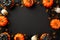 Halloween creepy decorations concept. Top view photo of pumpkins skulls jelly candies centipedes and spiders on isolated black