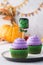 Halloween cupcakes decorated with funny chocolate green monster
