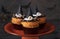 Halloween cupcakes decorated witch hat from mastic. Sweets for kids on Halloween party