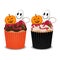 Halloween cupcakes with ghost, pumpkin and cherry.